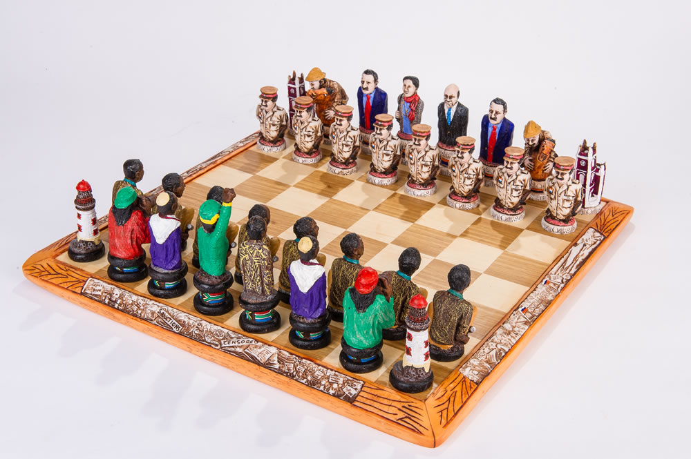 Several carved themed chess sets displayed together, showing how character pieces can vary in shape and readability